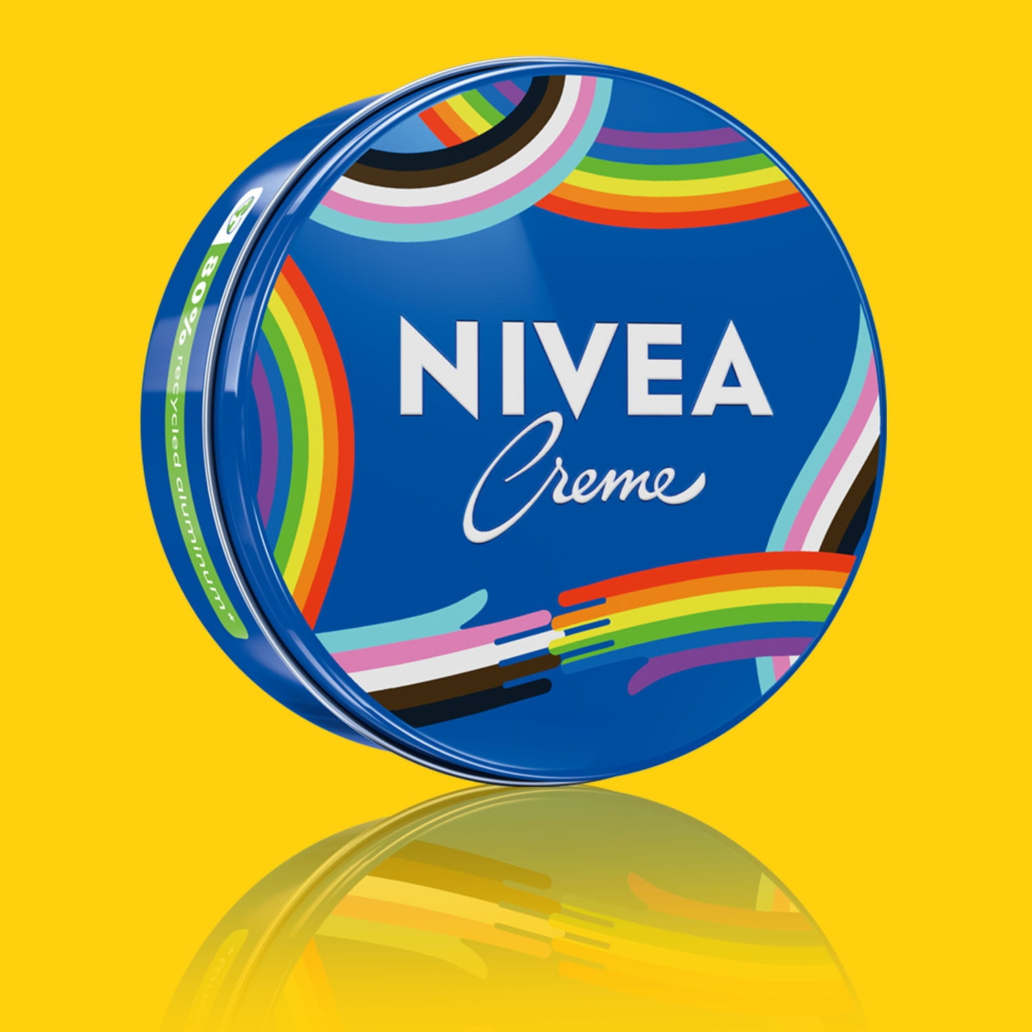 A Pride Limited Edition NIVEA Creme product in a blue tin with the pride rainbow printed on the front, against a yellow background.